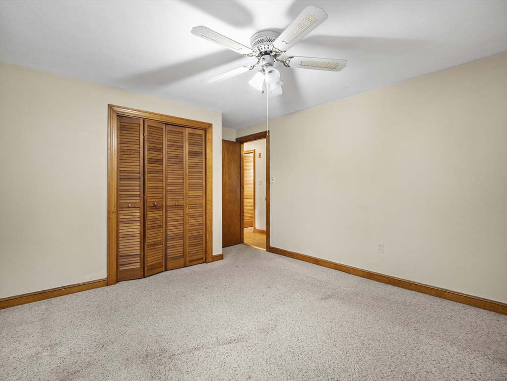 11 Dane Street Peabody, MA 01960 - Photo 9 of 27 an empty room with windows and fan