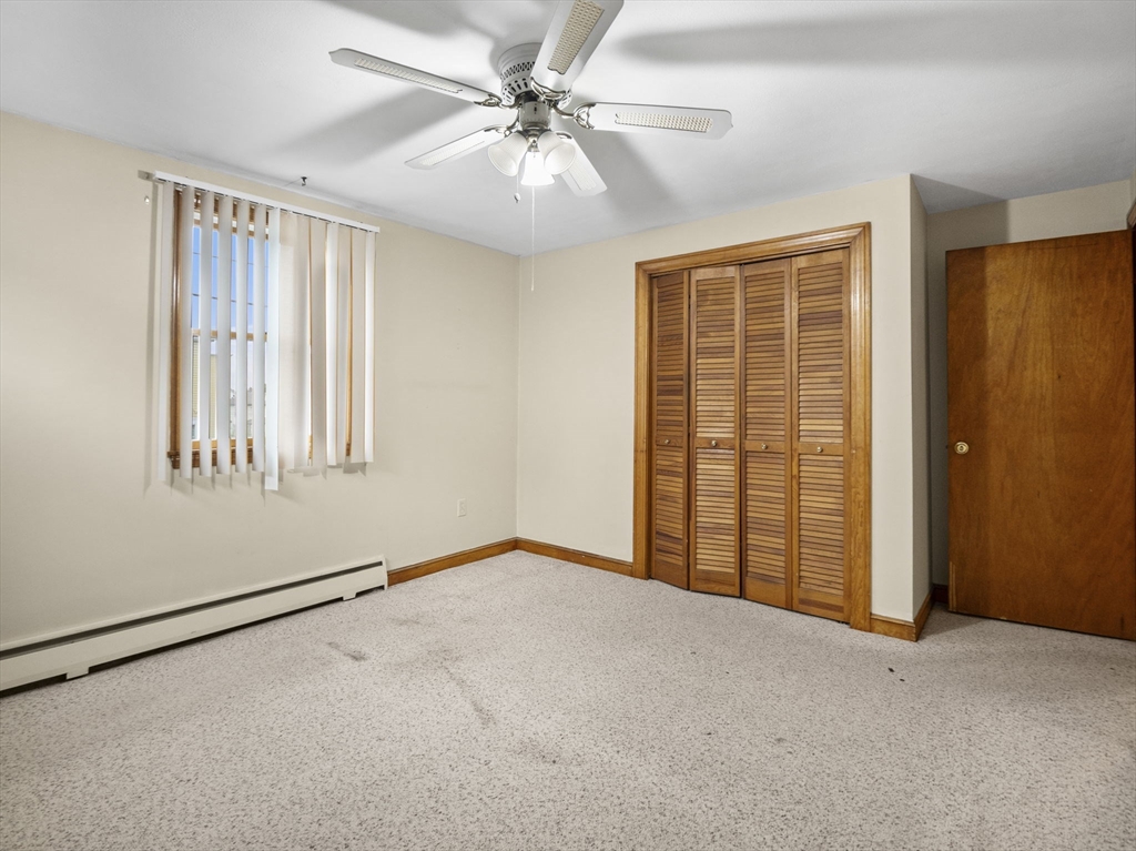 11 Dane Street Peabody, MA 01960 - Photo 10 of 27 an empty room with windows and fan