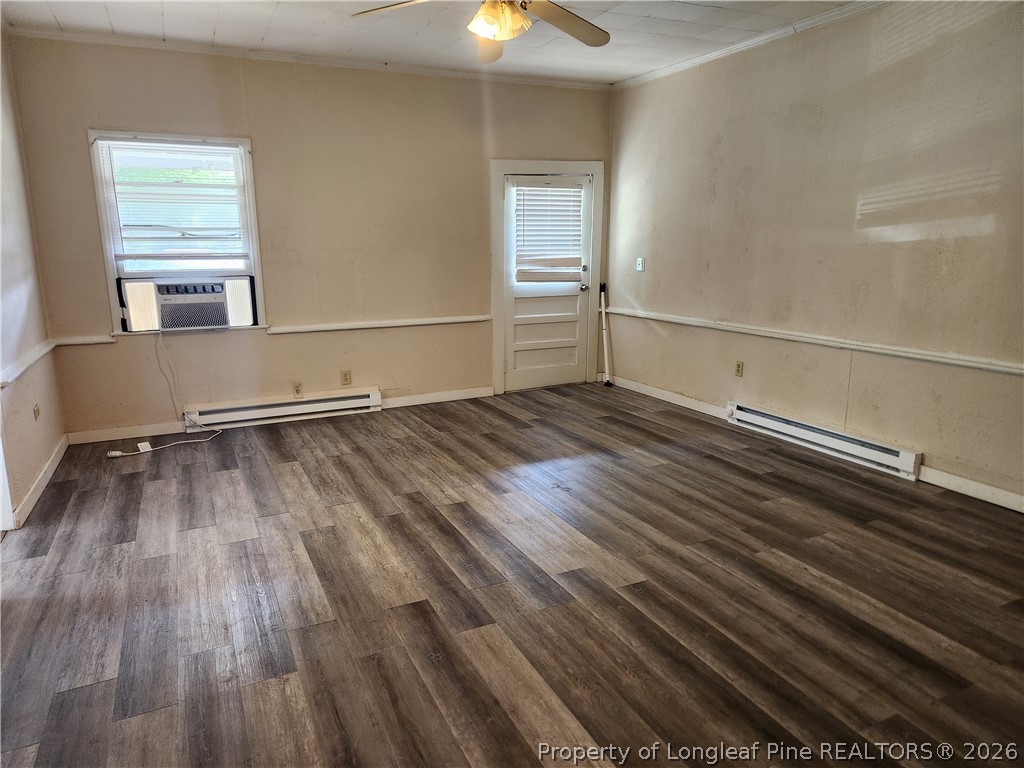 3939 Ellison Street Hope Mills, NC 28348 - Photo 2 of 7 a view of empty room with wooden floor and window