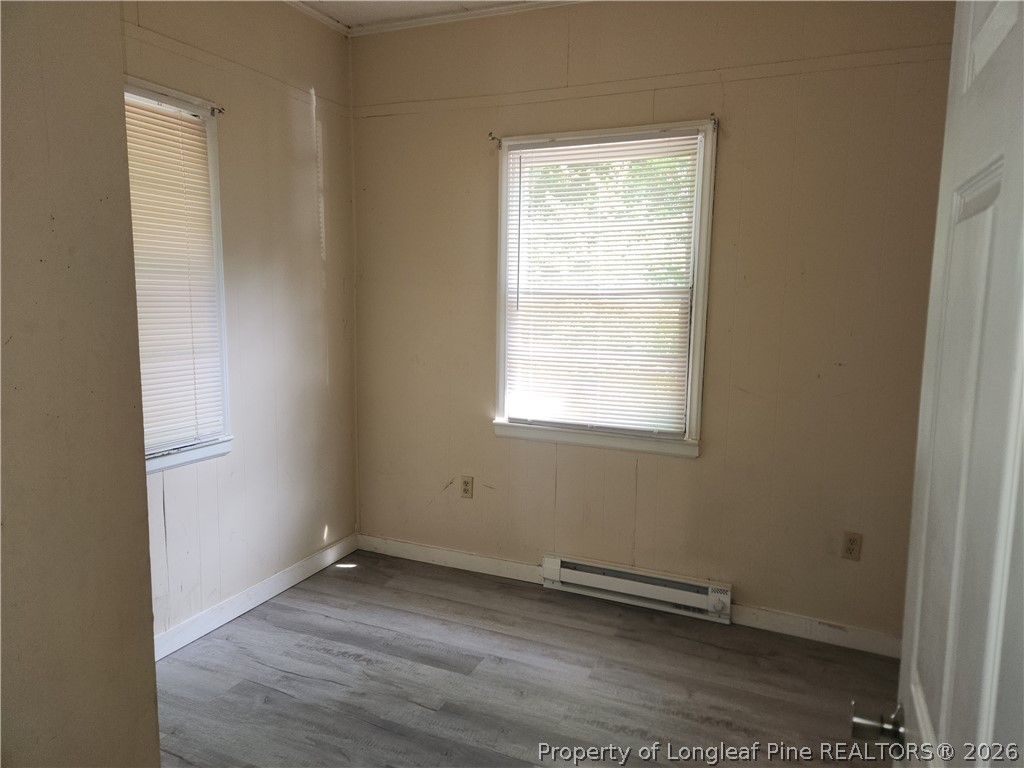 3939 Ellison Street Hope Mills, NC 28348 - Photo 5 of 7 a view of a room with wooden floor and window