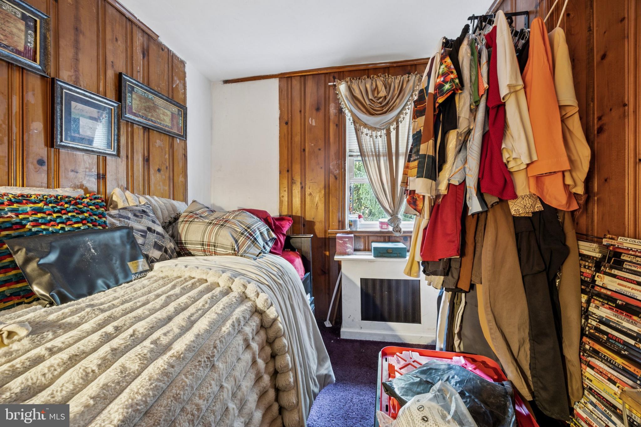 722 Yeadon Avenue Lansdowne, PA 19050 - Photo 16 of 23 a bed room with a bed and a painting on the wall