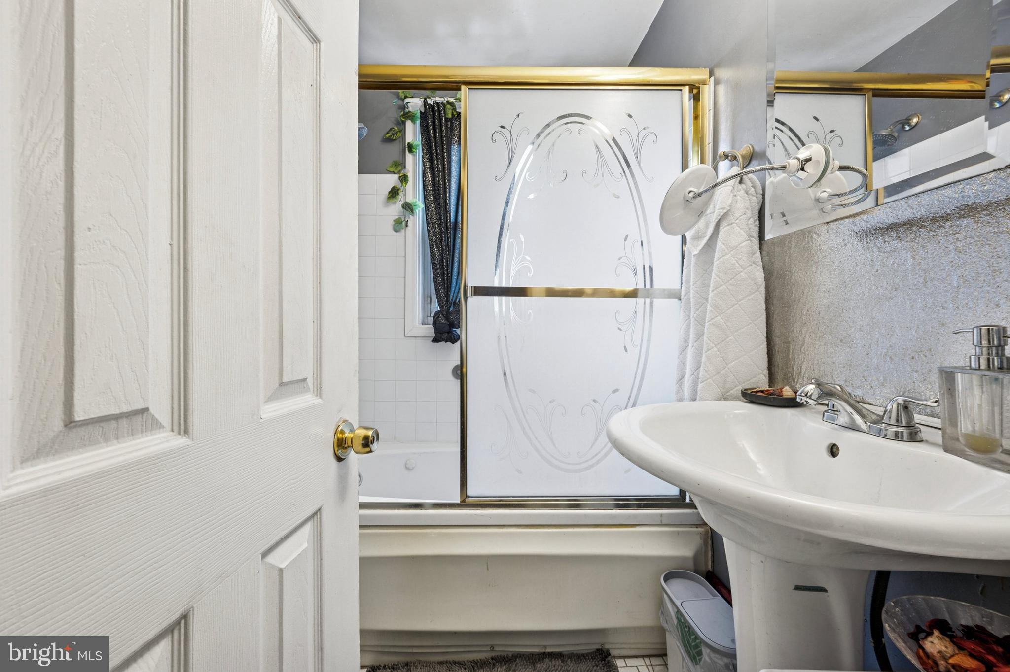 722 Yeadon Avenue Lansdowne, PA 19050 - Photo 17 of 23 a bathroom with a sink and a mirror