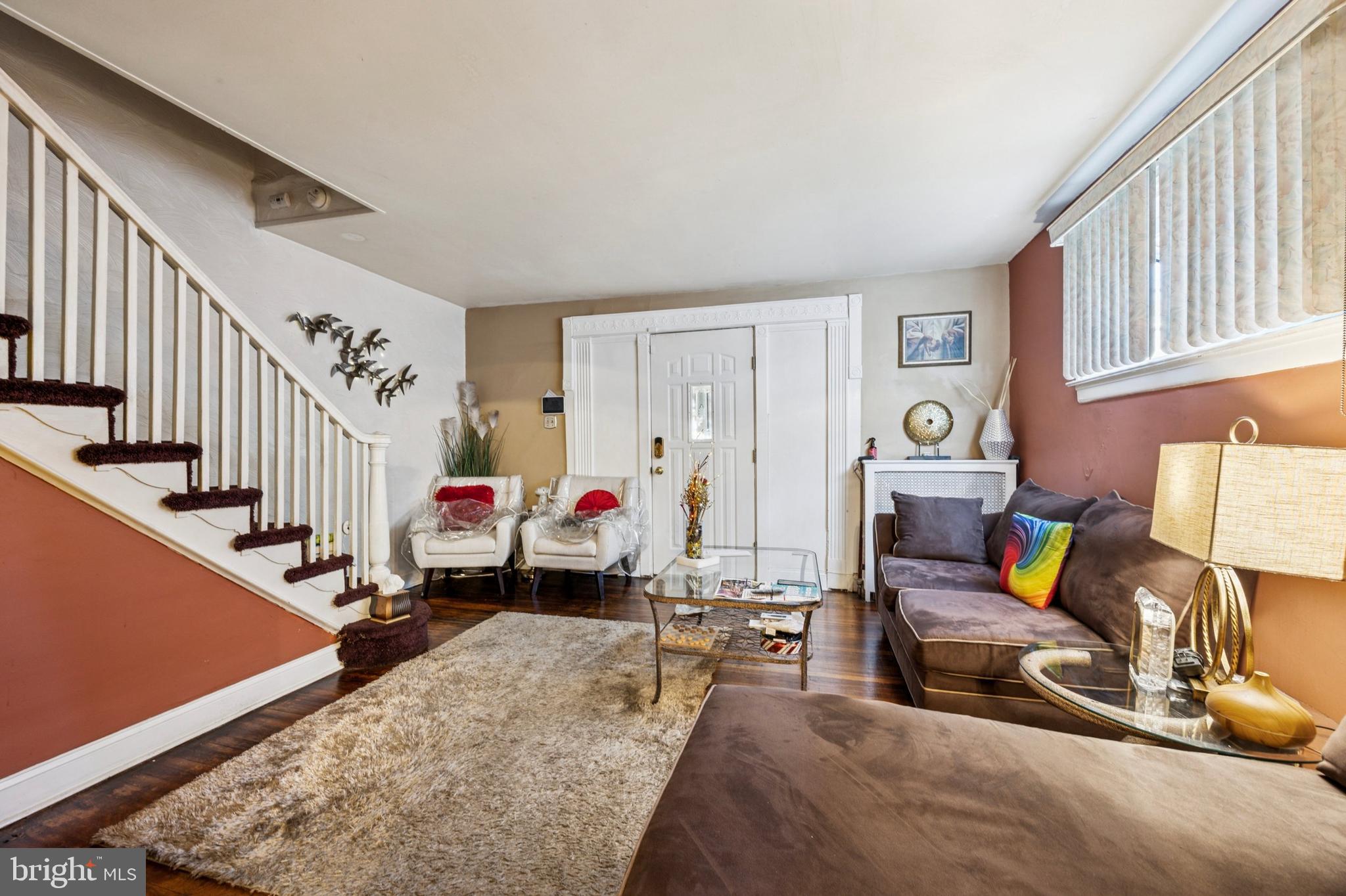 722 Yeadon Avenue Lansdowne, PA 19050 - Photo 6 of 23 a living room with furniture gym equipment and a rug