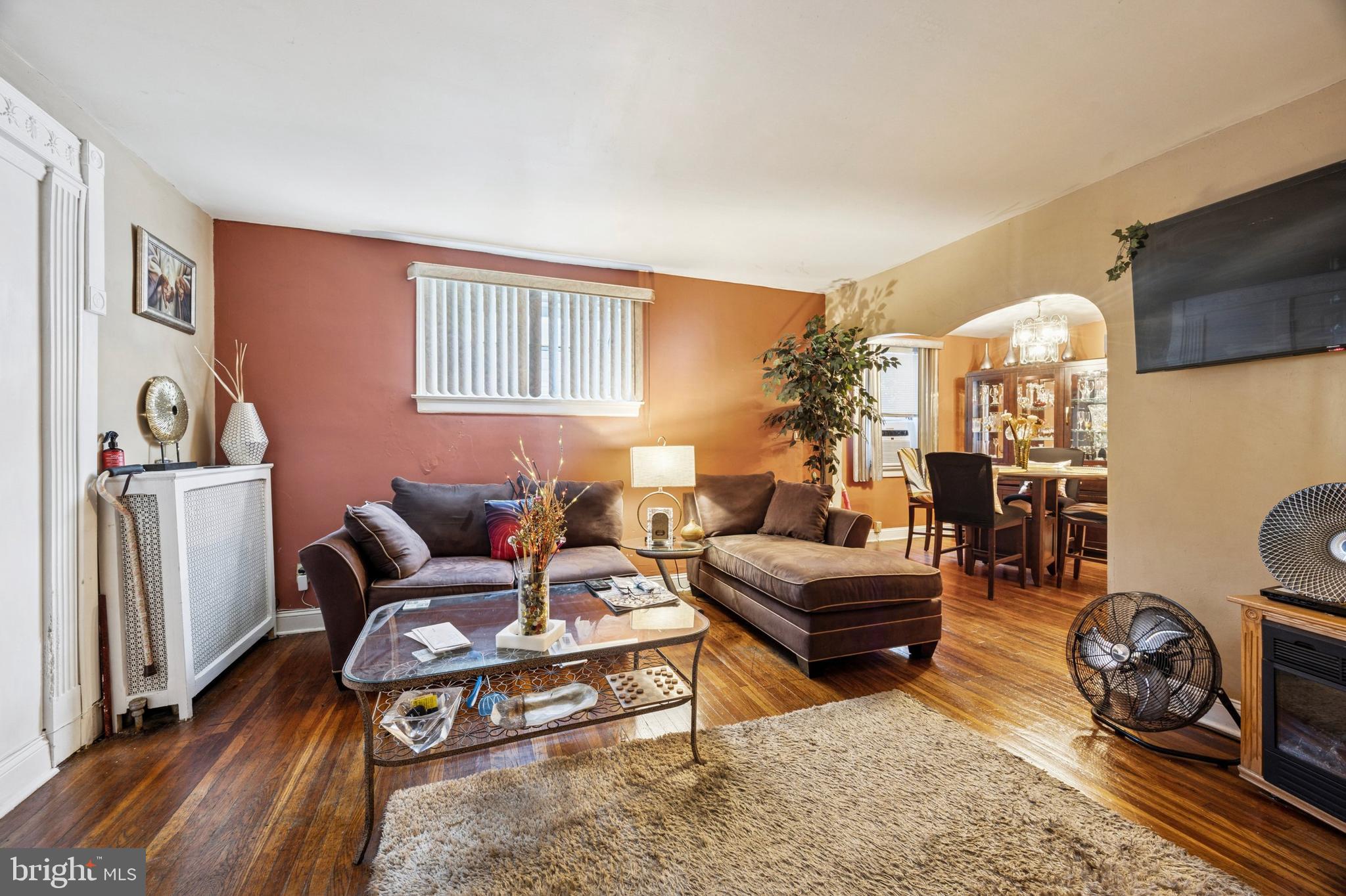 722 Yeadon Avenue Lansdowne, PA 19050 - Photo 7 of 23 a living room with furniture a couch and large window