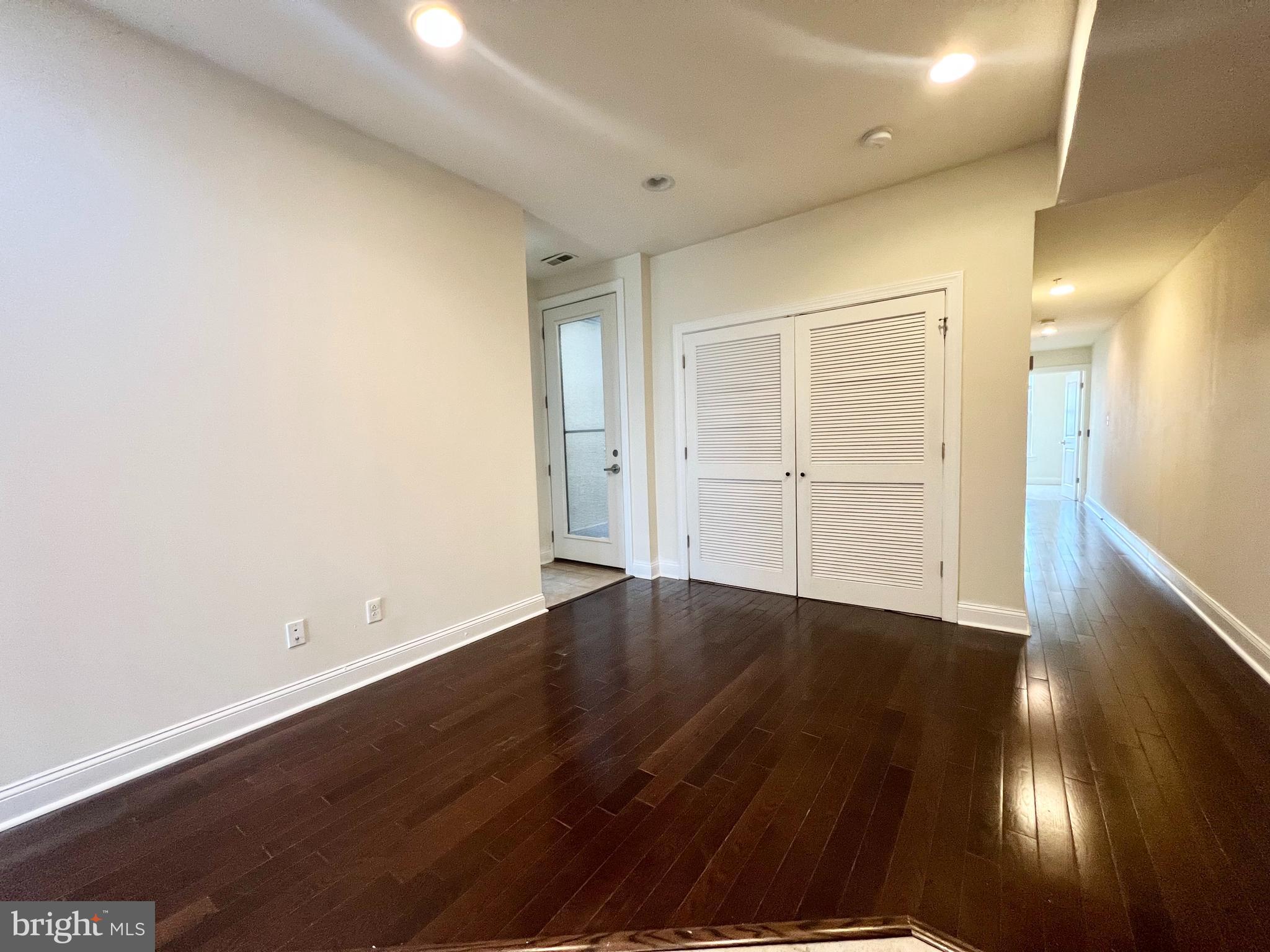 1806 North 16th Street, Unit A Philadelphia, PA 19121 - Photo 4 of 8 an empty room with wooden floor and closet