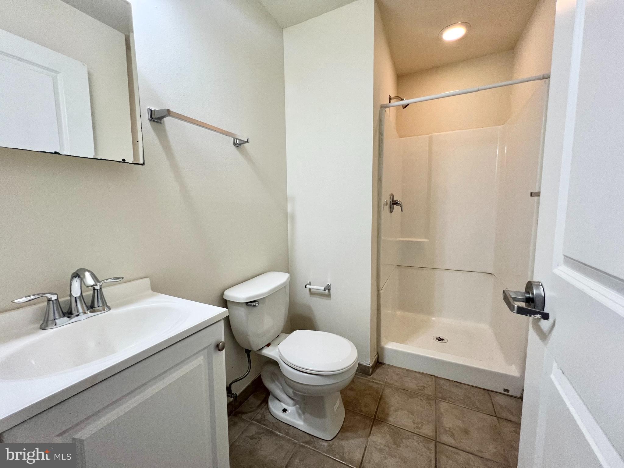 1806 North 16th Street, Unit A Philadelphia, PA 19121 - Photo 8 of 8 a bathroom with a toilet a sink and shower