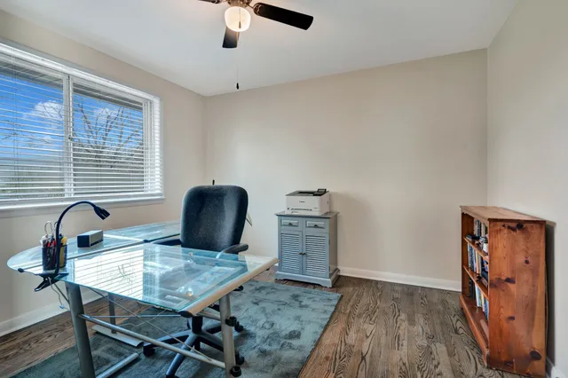 a workspace with furniture and window