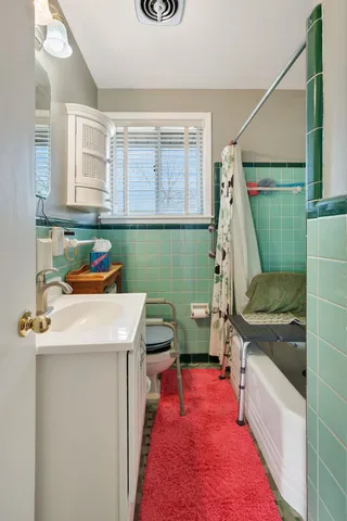 a utility room with a sink a washer and dryer