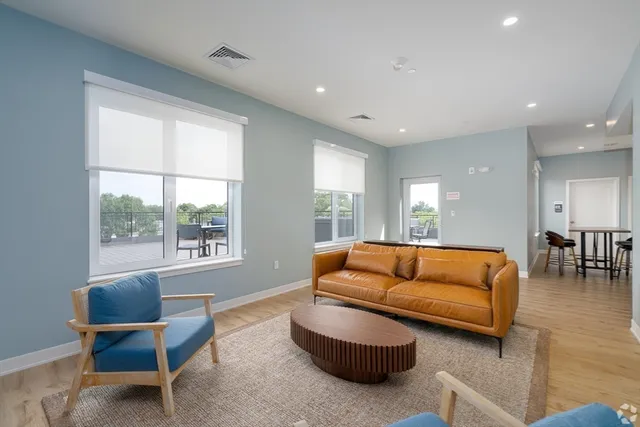 a living room with furniture and a large window