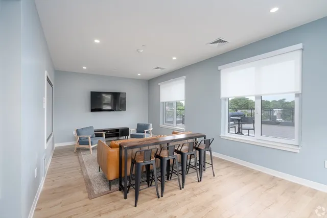 a view of a dining room with furniture window and outside view