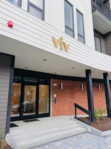 a front view of a building with glass windows