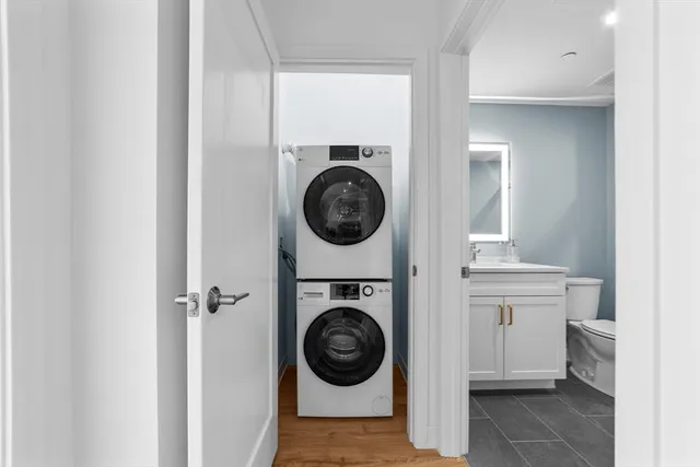 a view of a hallway with washer and dryer