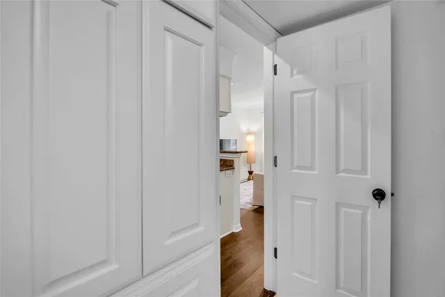 a bathroom with a shower and a glass door