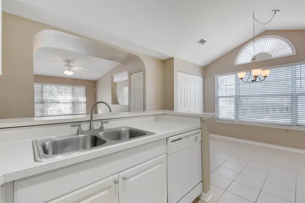 a kitchen with a sink and cabinets