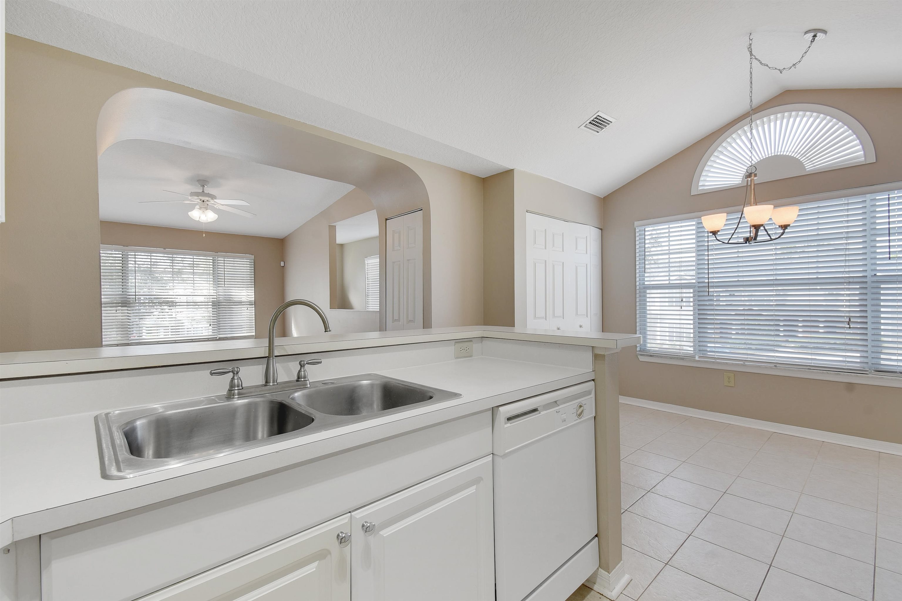 24200 Harbour Vista Circle St. Augustine, FL 32080 - Photo 15 of 30 a kitchen with a sink and cabinets