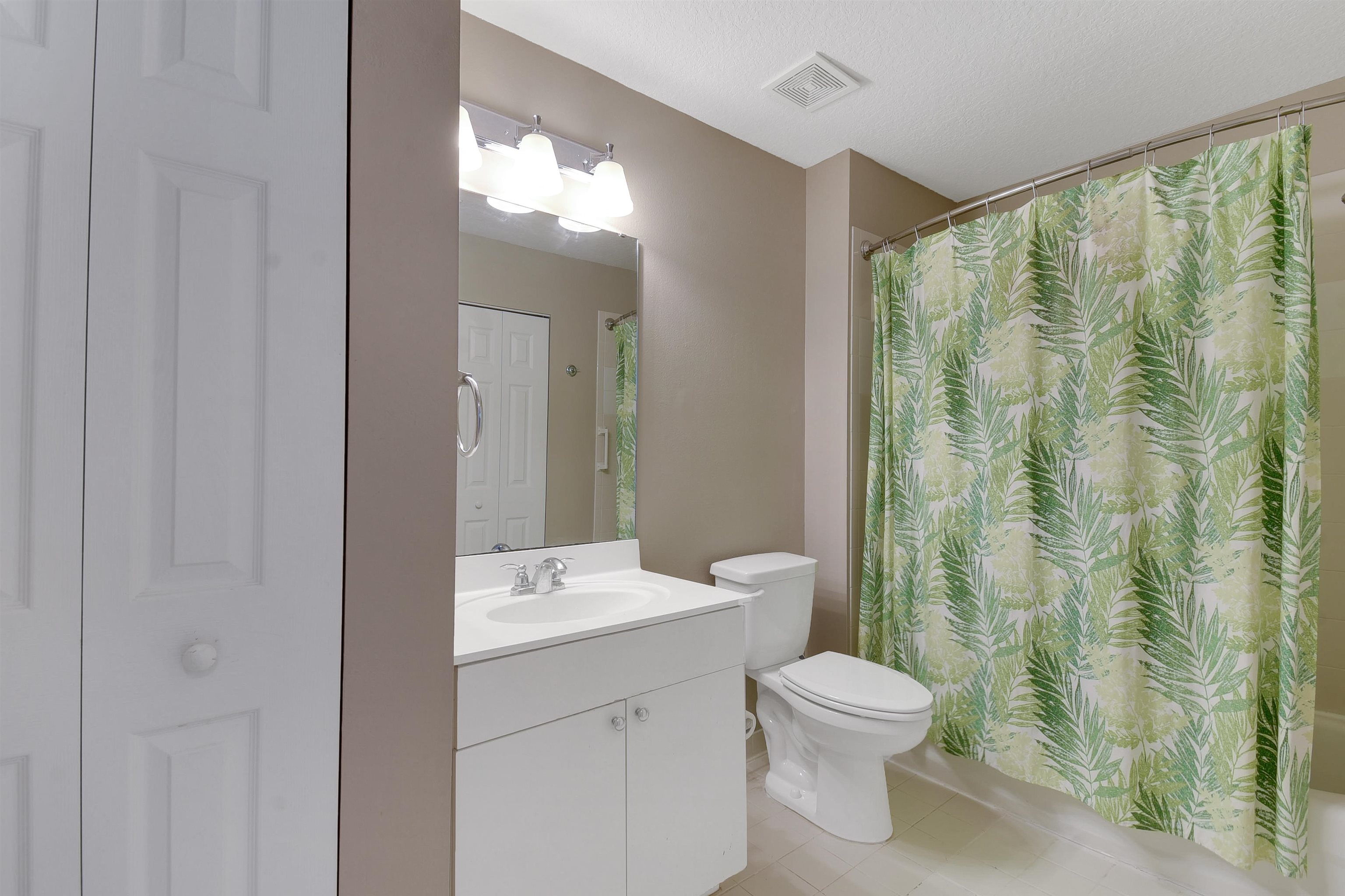 24200 Harbour Vista Circle St. Augustine, FL 32080 - Photo 19 of 30 a bathroom with a toilet a sink and a mirror