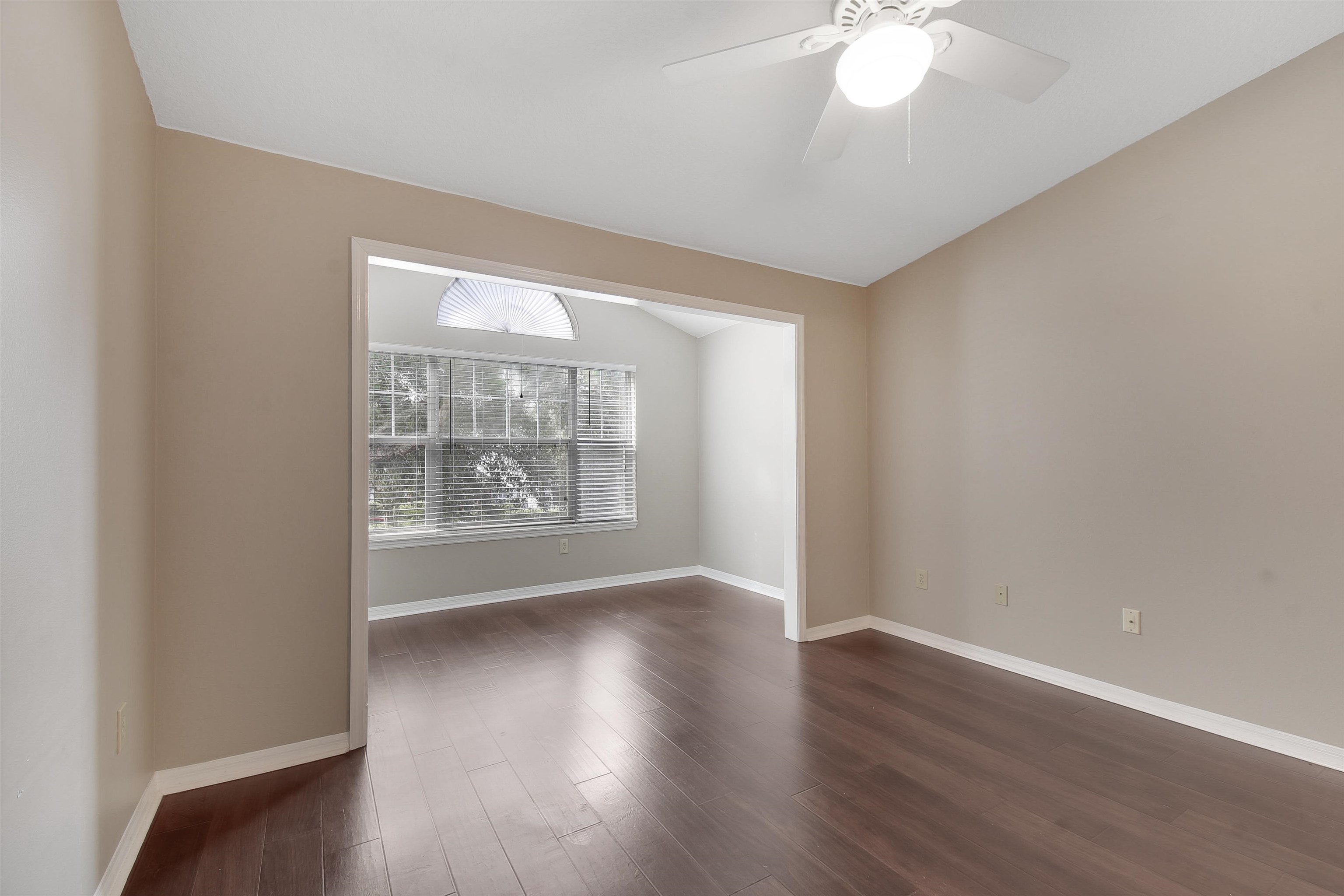 24200 Harbour Vista Circle St. Augustine, FL 32080 - Photo 23 of 30 an empty room with wooden floor and windows
