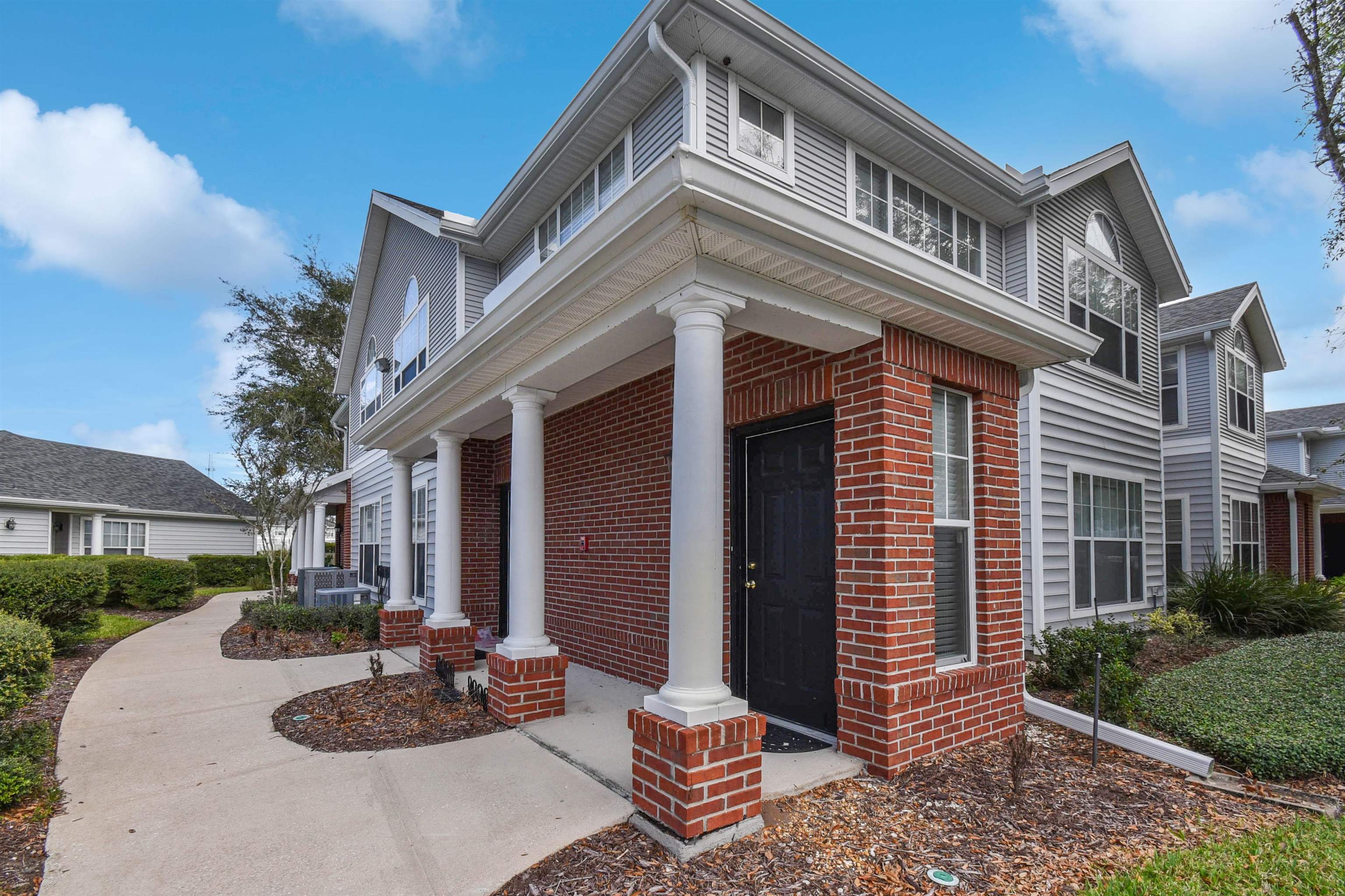 24200 Harbour Vista Circle St. Augustine, FL 32080 - Photo 5 of 30 a view of a patio with couches and potted plants