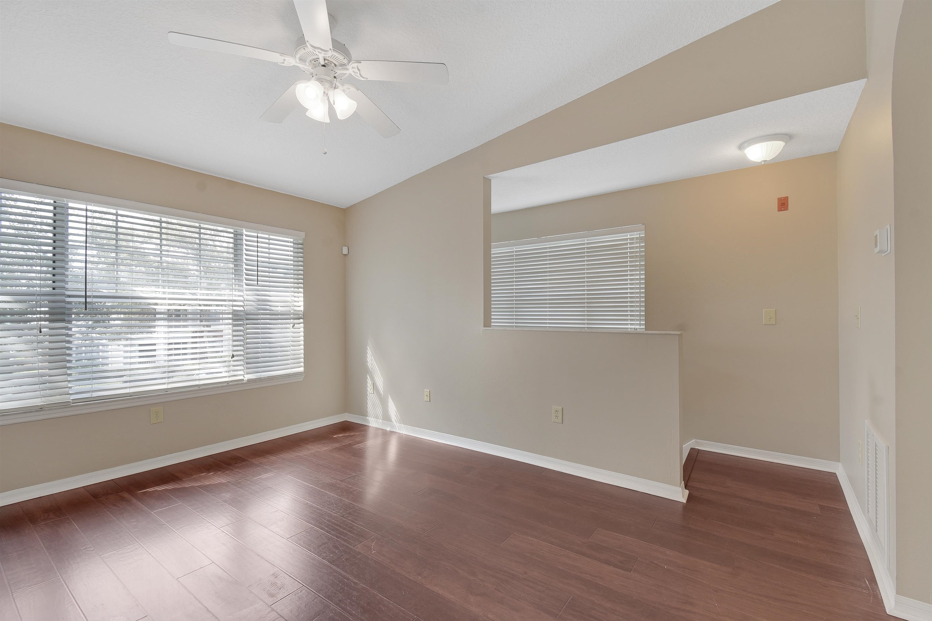 24200 Harbour Vista Circle St. Augustine, FL 32080 - Photo 8 of 30 a view of an empty room with wooden floor and a window