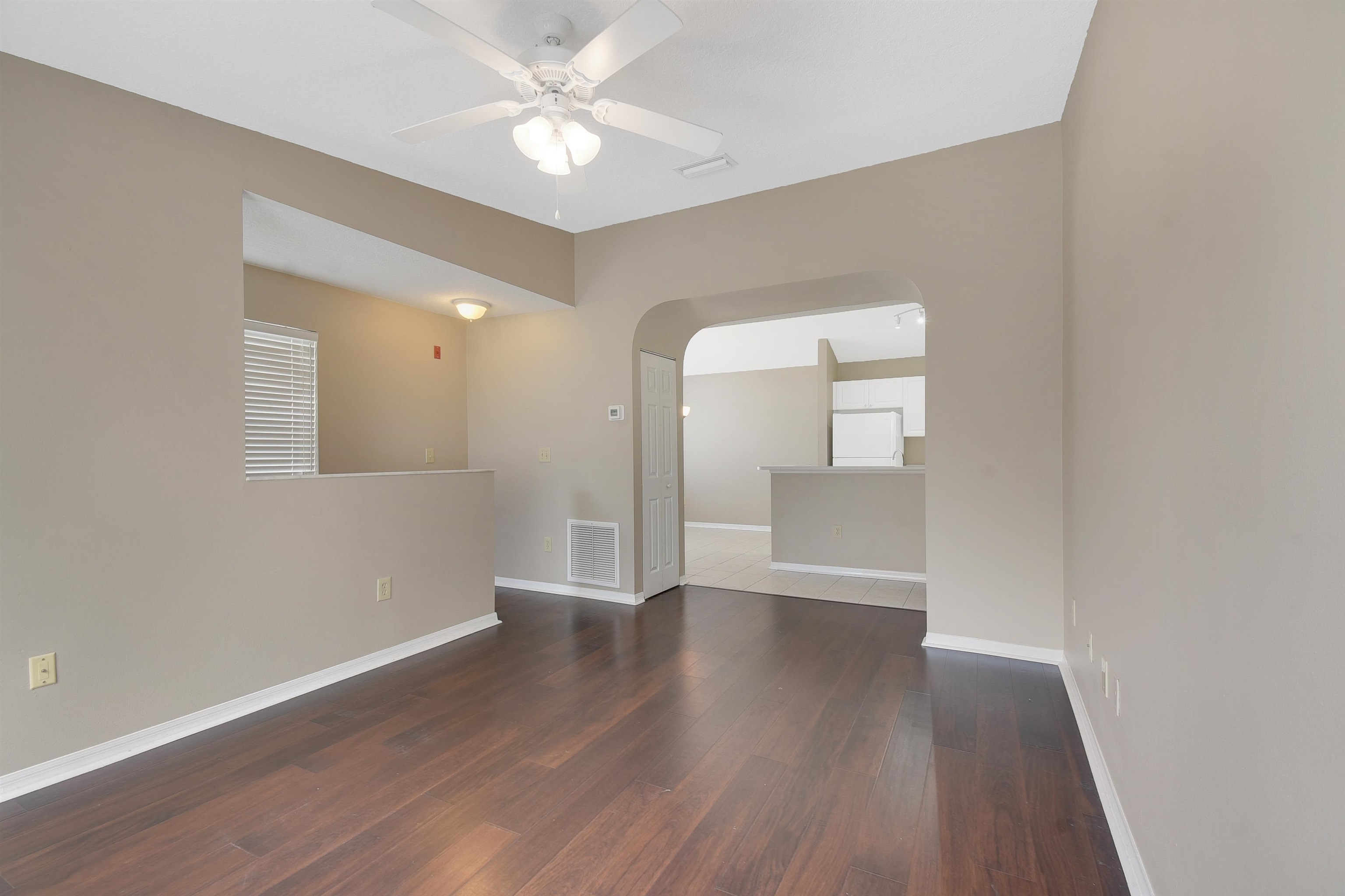 24200 Harbour Vista Circle St. Augustine, FL 32080 - Photo 10 of 30 an empty room with wooden floor and windows