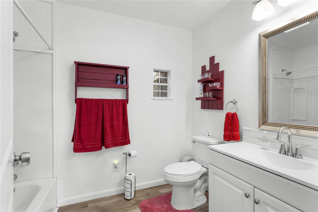 351 County Road 2601 Meridian, TX 76665 - Photo 28 of 40 a bathroom with a toilet sink and shower
