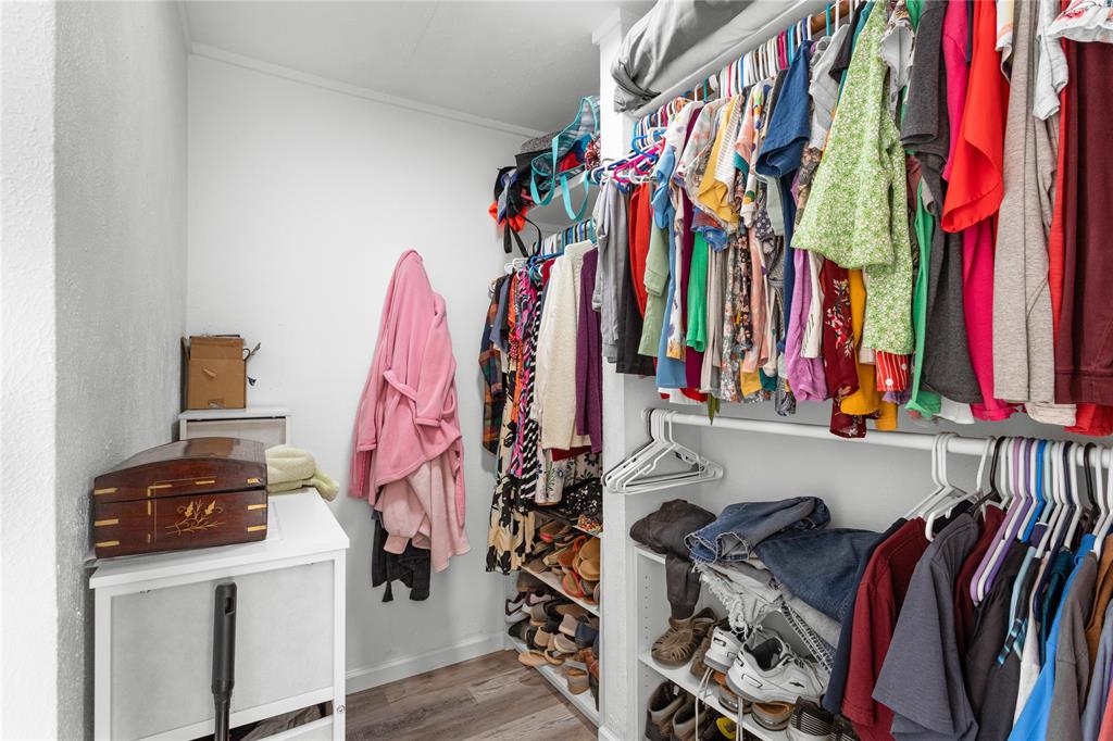 351 County Road 2601 Meridian, TX 76665 - Photo 31 of 40 a view of walk in closet with clothes