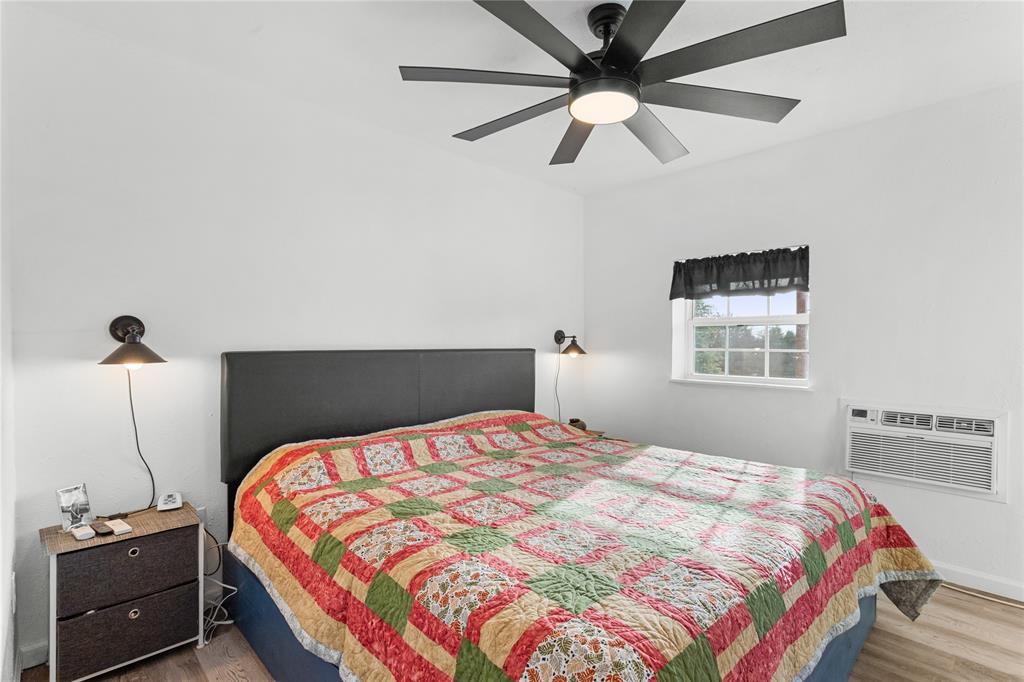 351 County Road 2601 Meridian, TX 76665 - Photo 34 of 40 a bedroom with a bed and a ceiling fan