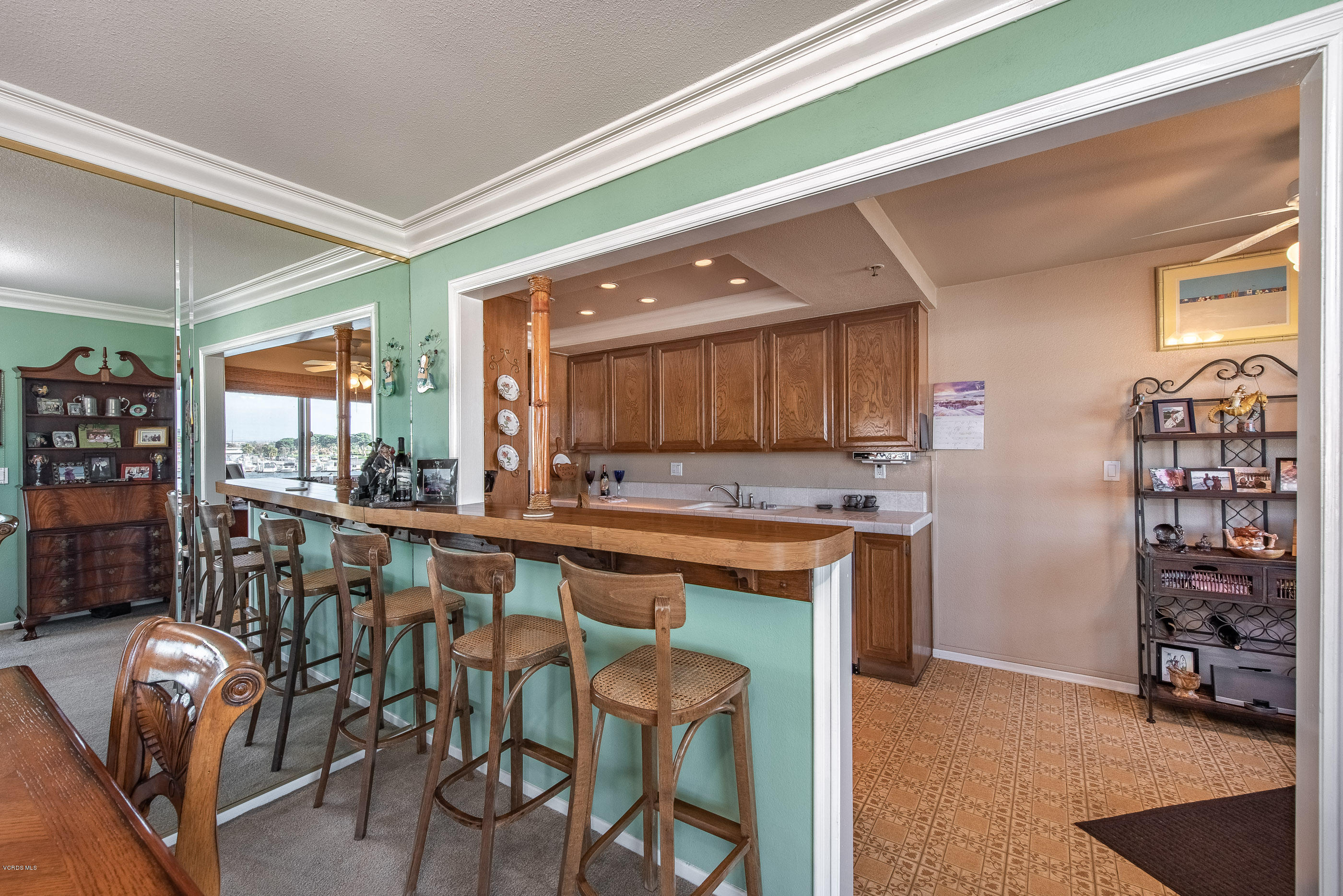 2872 Coast Circle, Unit 203 Huntington Beach, CA 92649 - Photo 2 of 42 a large kitchen with a table and chairs in it