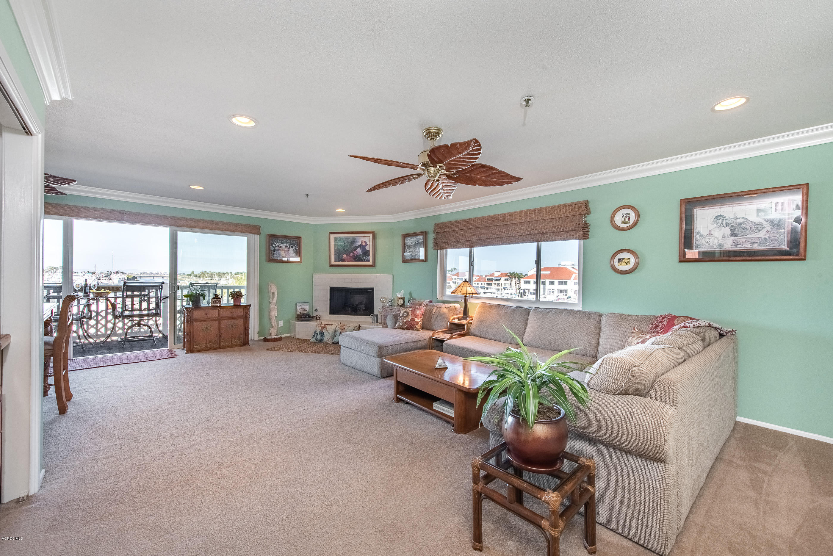 2872 Coast Circle, Unit 203 Huntington Beach, CA 92649 - Photo 11 of 42 a living room with furniture and a large window