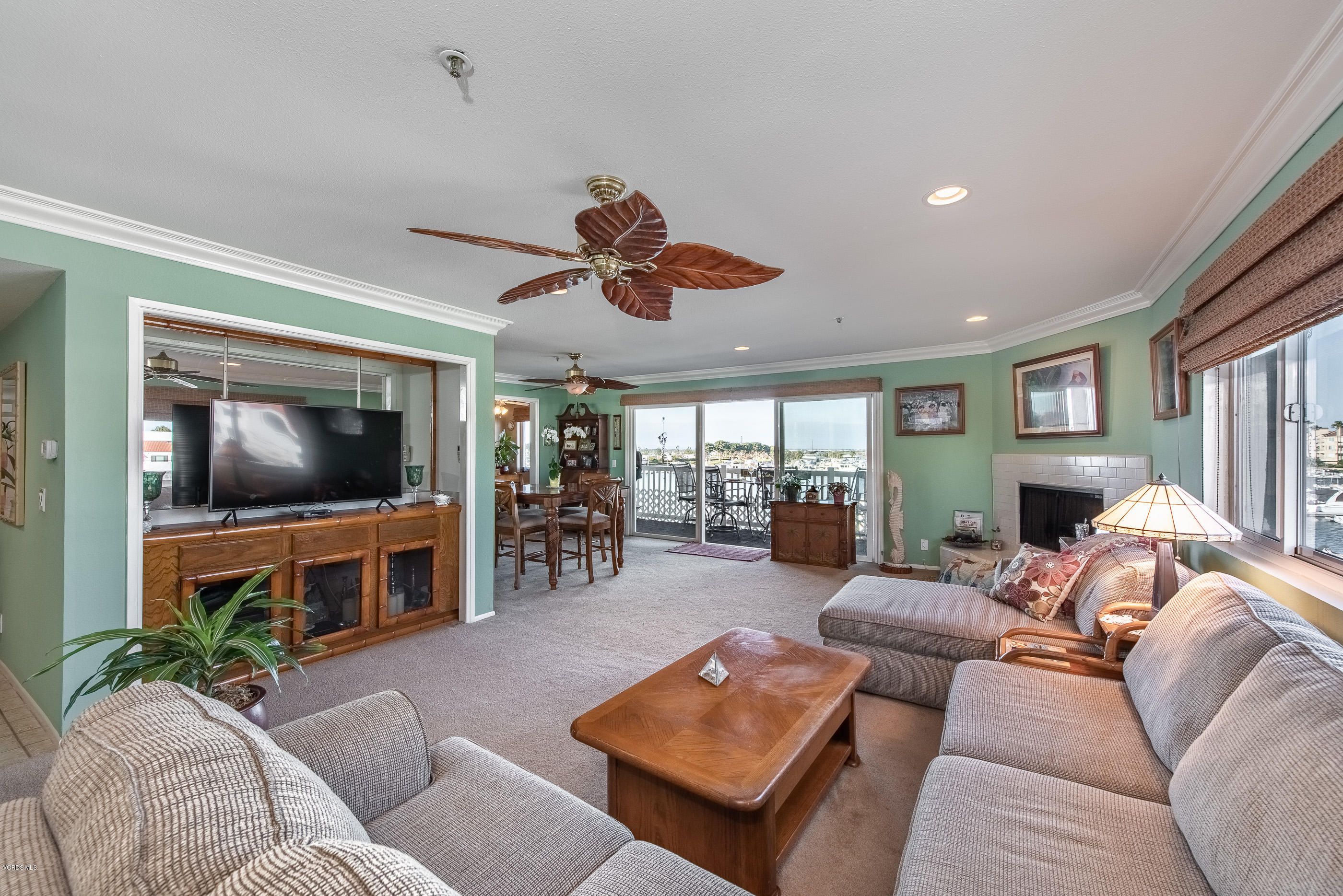 2872 Coast Circle, Unit 203 Huntington Beach, CA 92649 - Photo 12 of 42 a living room with furniture and a flat screen tv