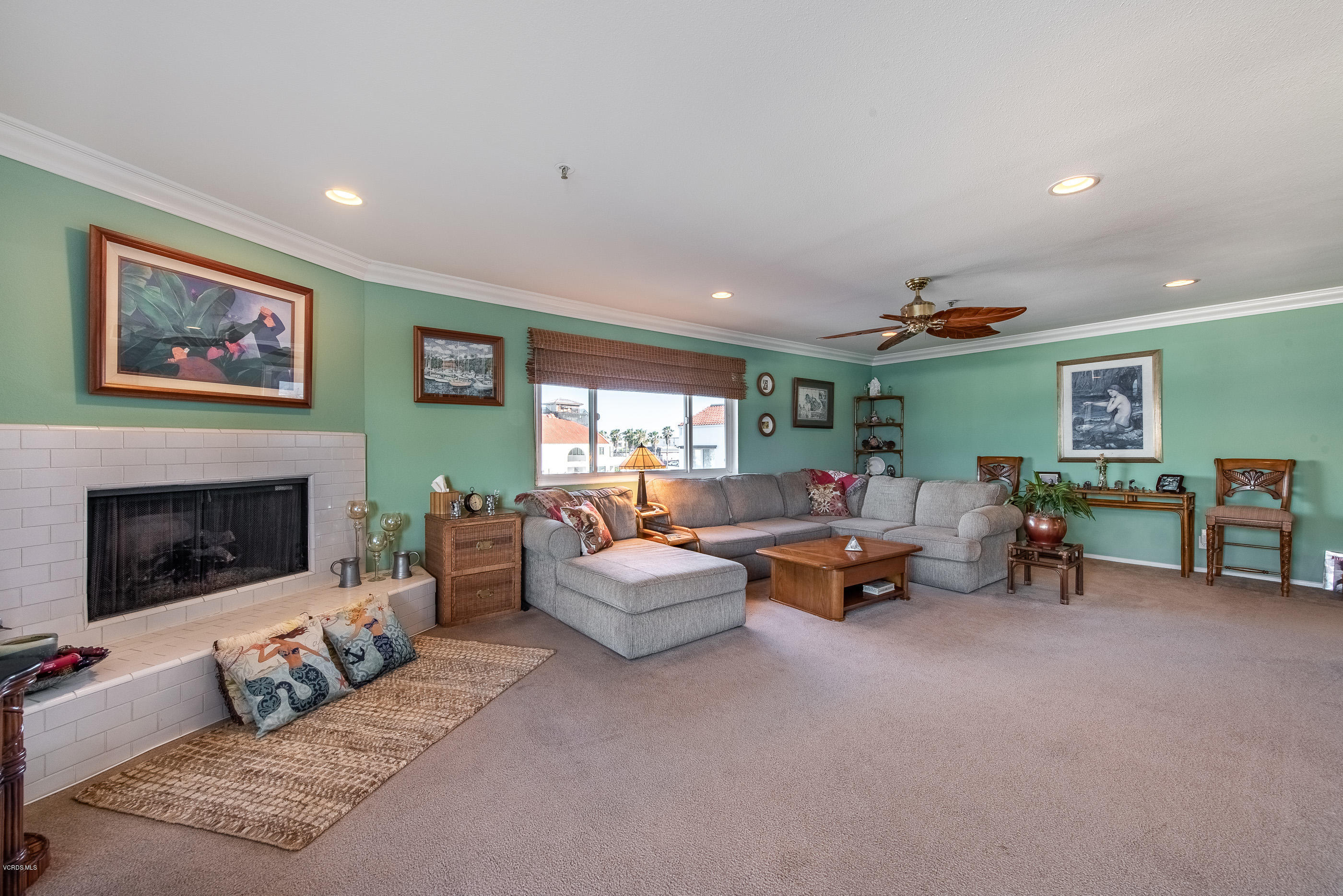 2872 Coast Circle, Unit 203 Huntington Beach, CA 92649 - Photo 13 of 42 a living room with furniture and a fireplace