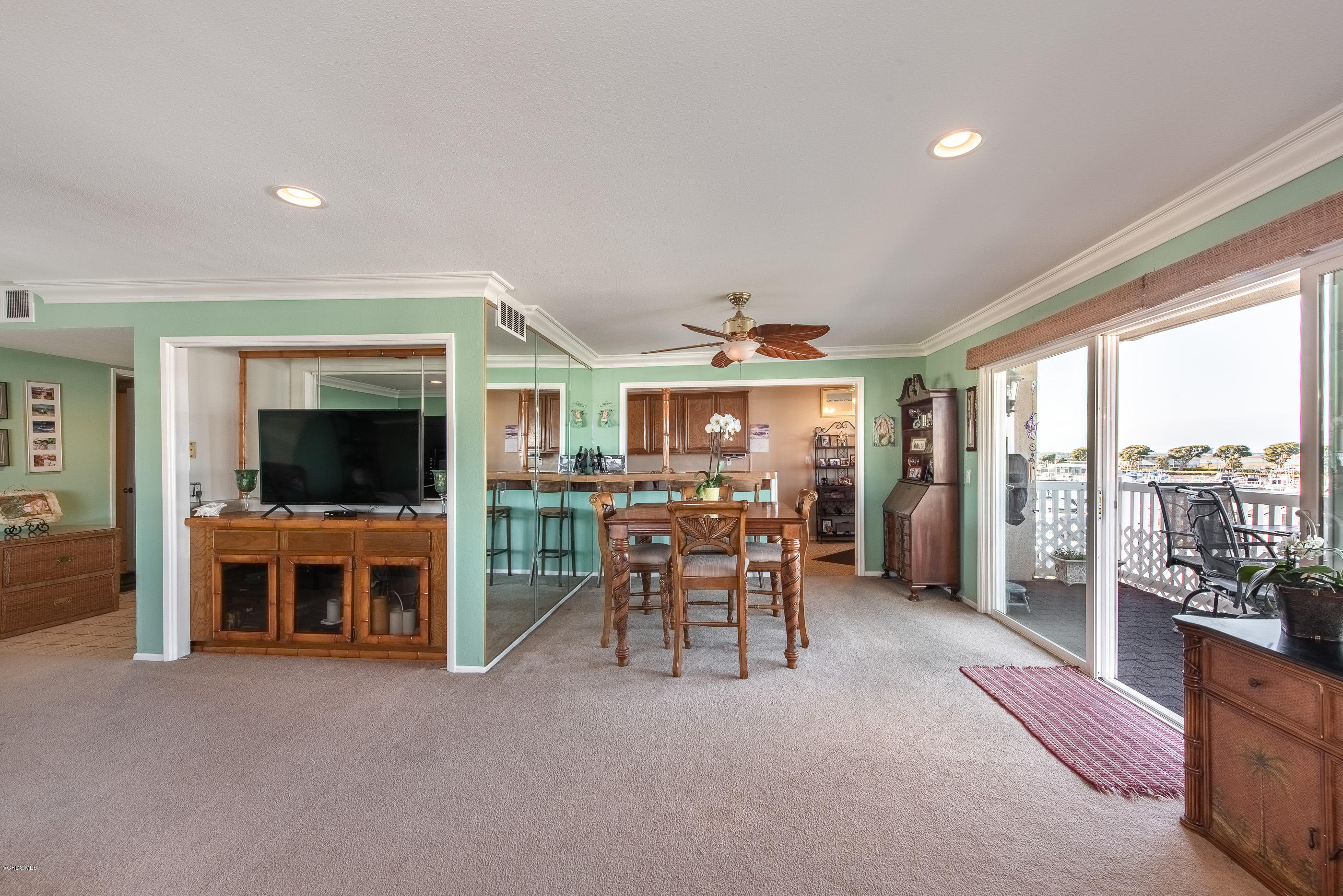 2872 Coast Circle, Unit 203 Huntington Beach, CA 92649 - Photo 14 of 42 a living room with furniture and a flat screen tv
