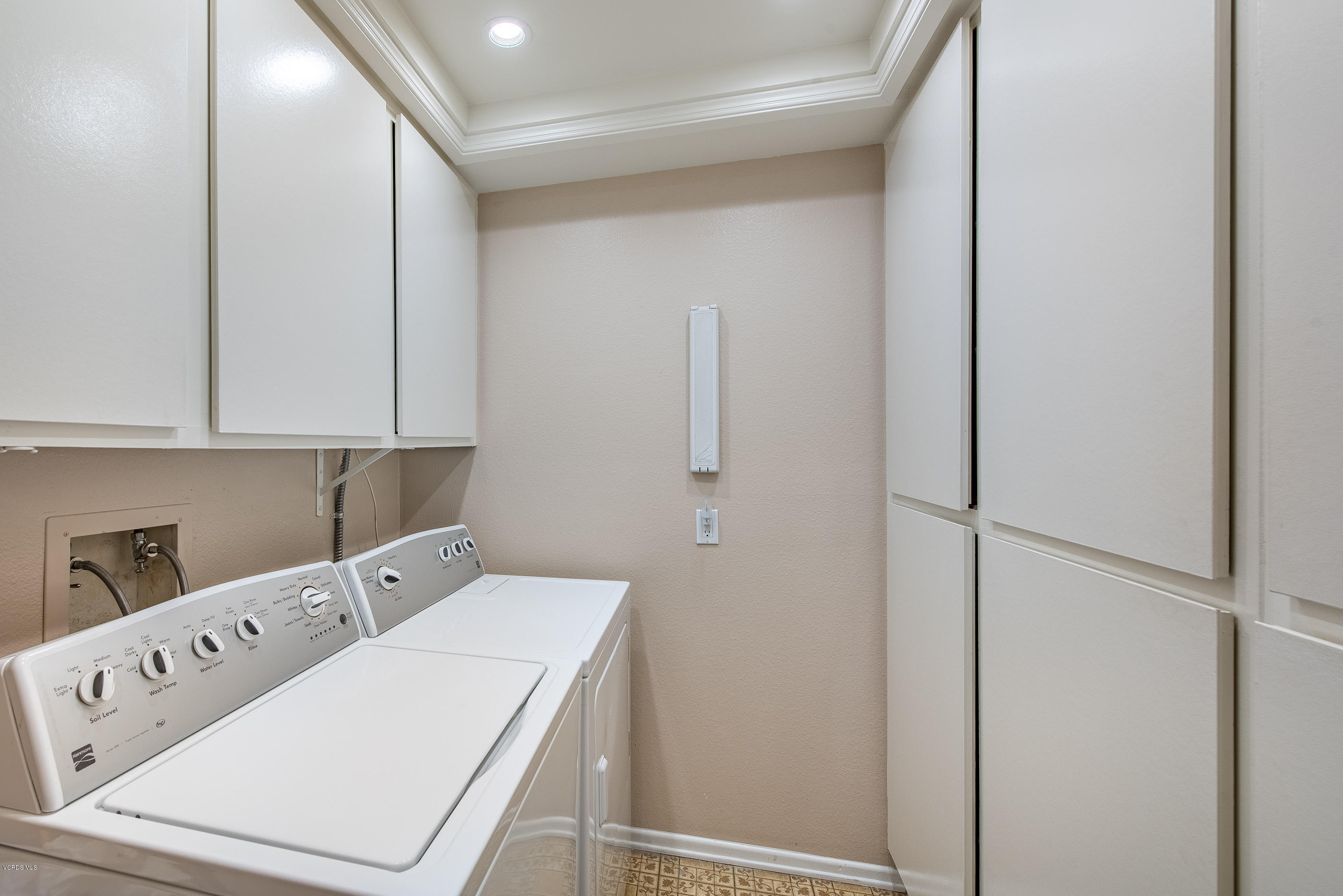 2872 Coast Circle, Unit 203 Huntington Beach, CA 92649 - Photo 19 of 42 a utility room with dryer and washer