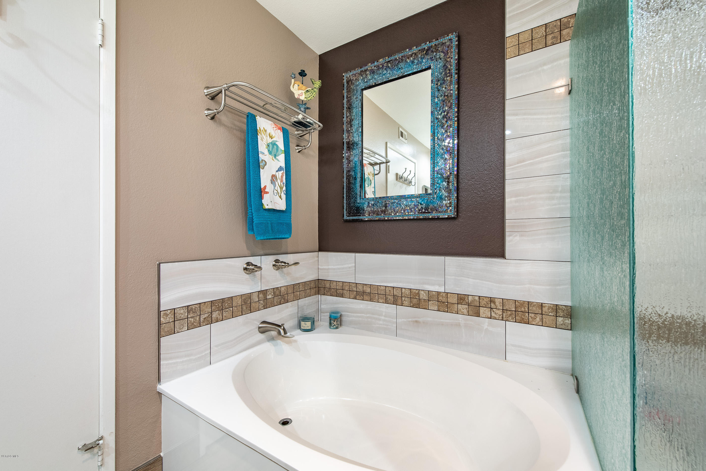 2872 Coast Circle, Unit 203 Huntington Beach, CA 92649 - Photo 27 of 42 a bathroom with a bathtub and a sink