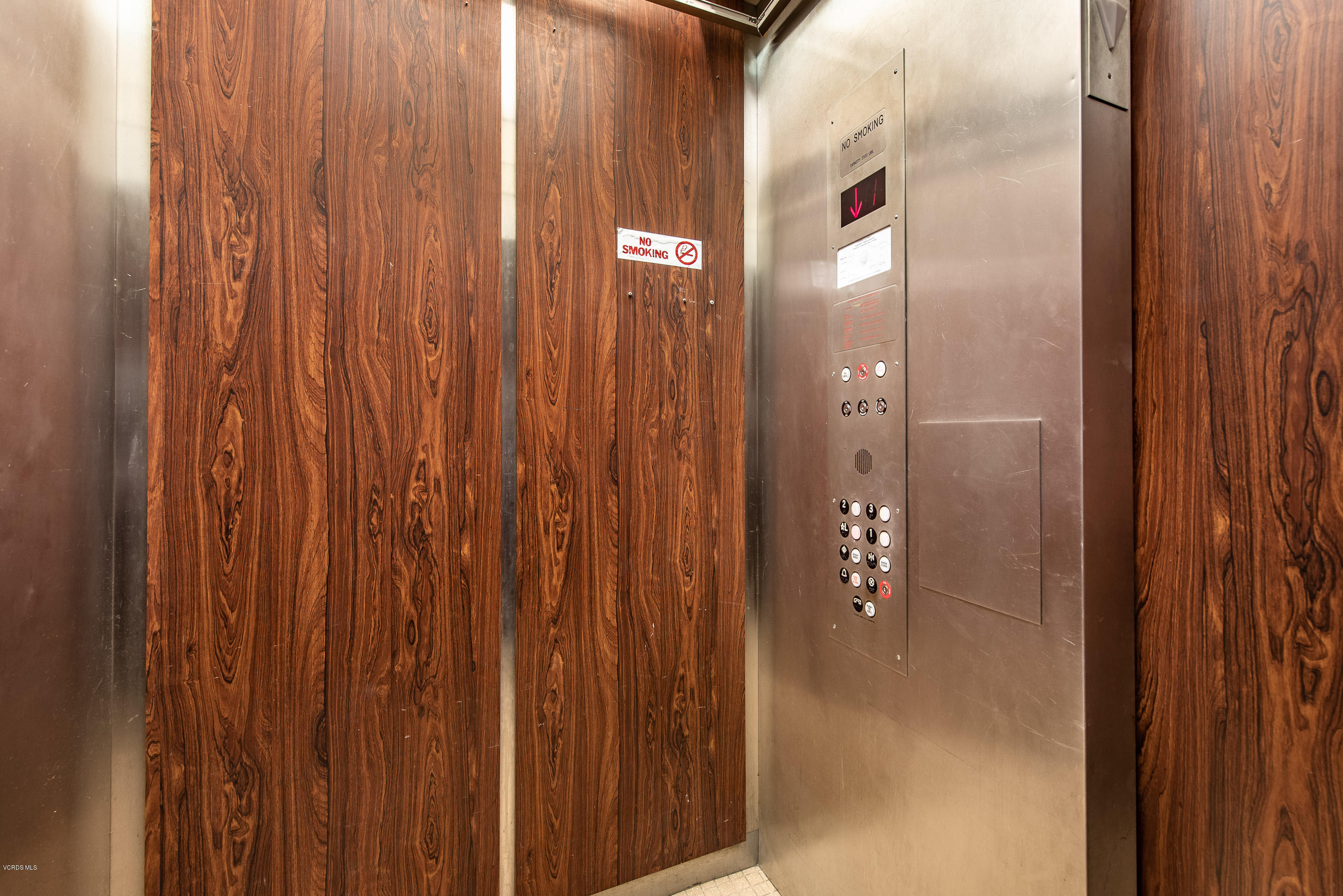 2872 Coast Circle, Unit 203 Huntington Beach, CA 92649 - Photo 31 of 42 a bathroom with a glass shower door