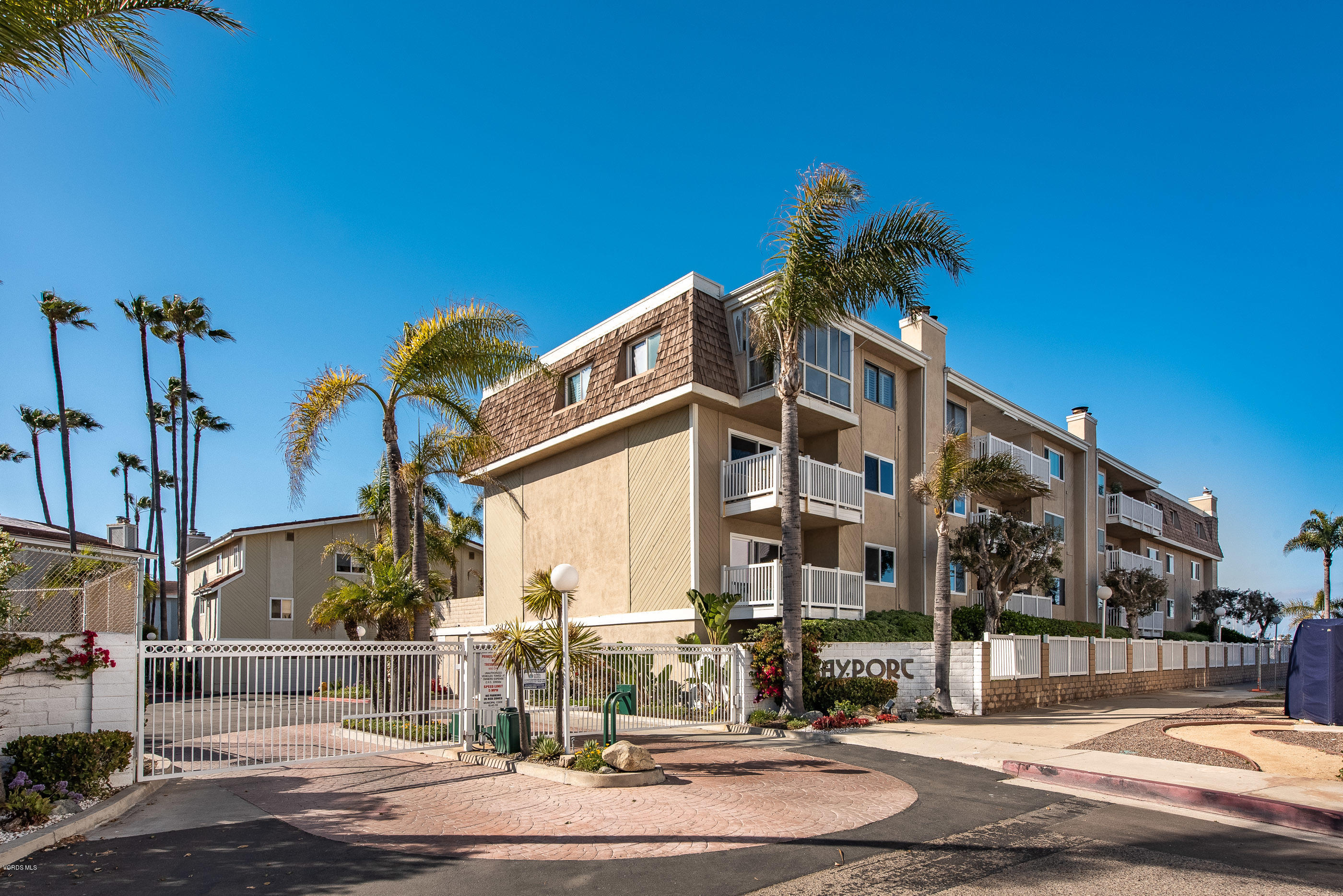2872 Coast Circle, Unit 203 Huntington Beach, CA 92649 - Photo 40 of 42 a front view of a building with street view