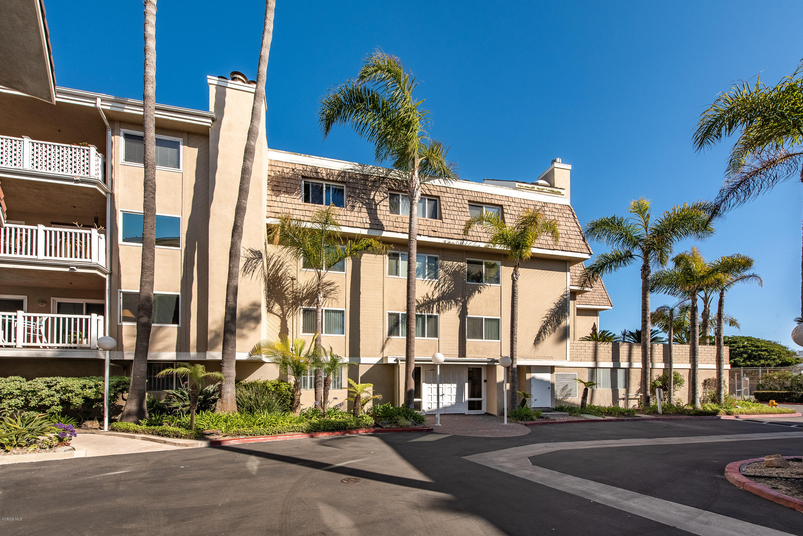 2872 Coast Circle, Unit 203 Huntington Beach, CA 92649 - Photo 42 of 42 front view of a building with a street