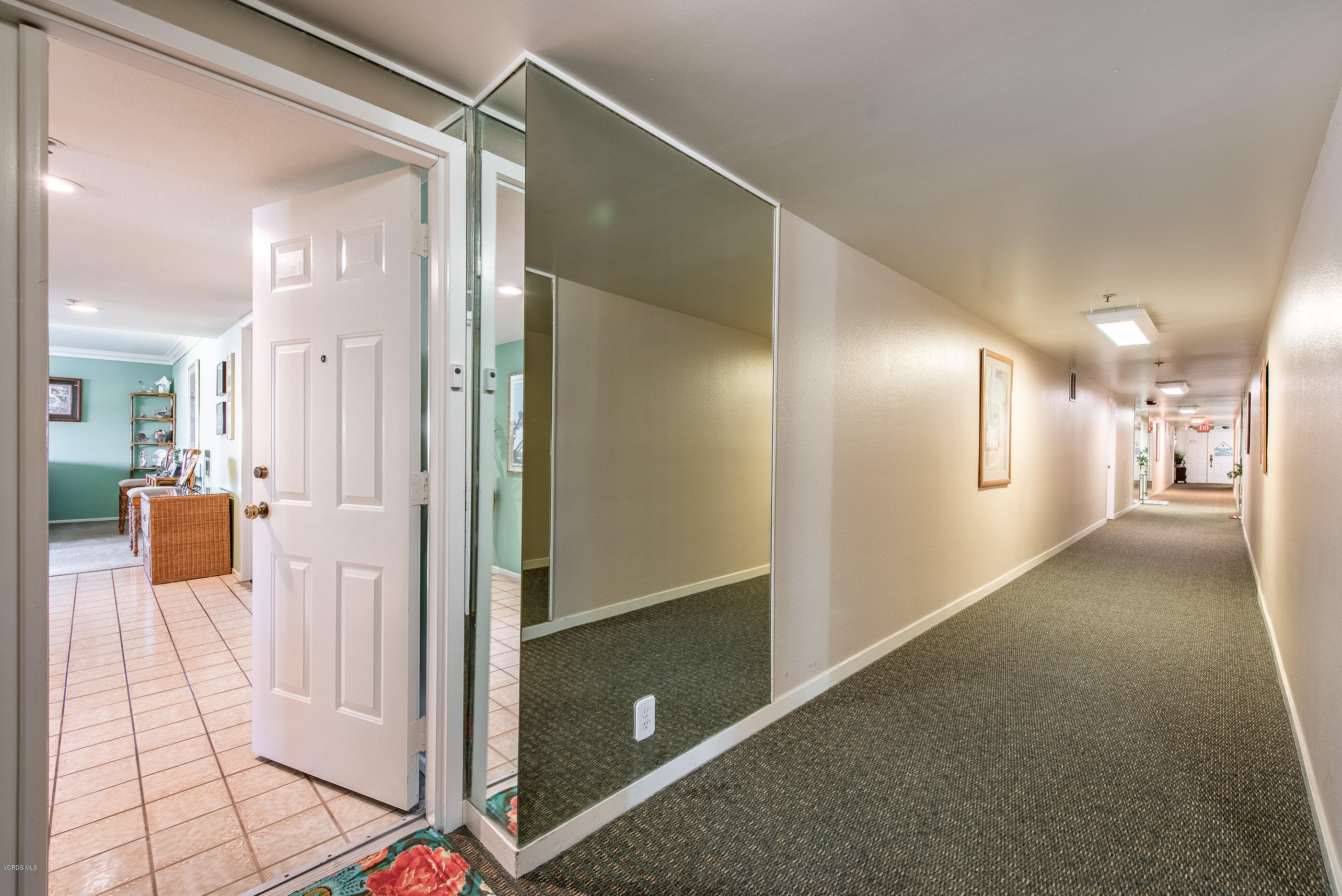 2872 Coast Circle, Unit 203 Huntington Beach, CA 92649 - Photo 8 of 42 a view of a hallway with wooden floor