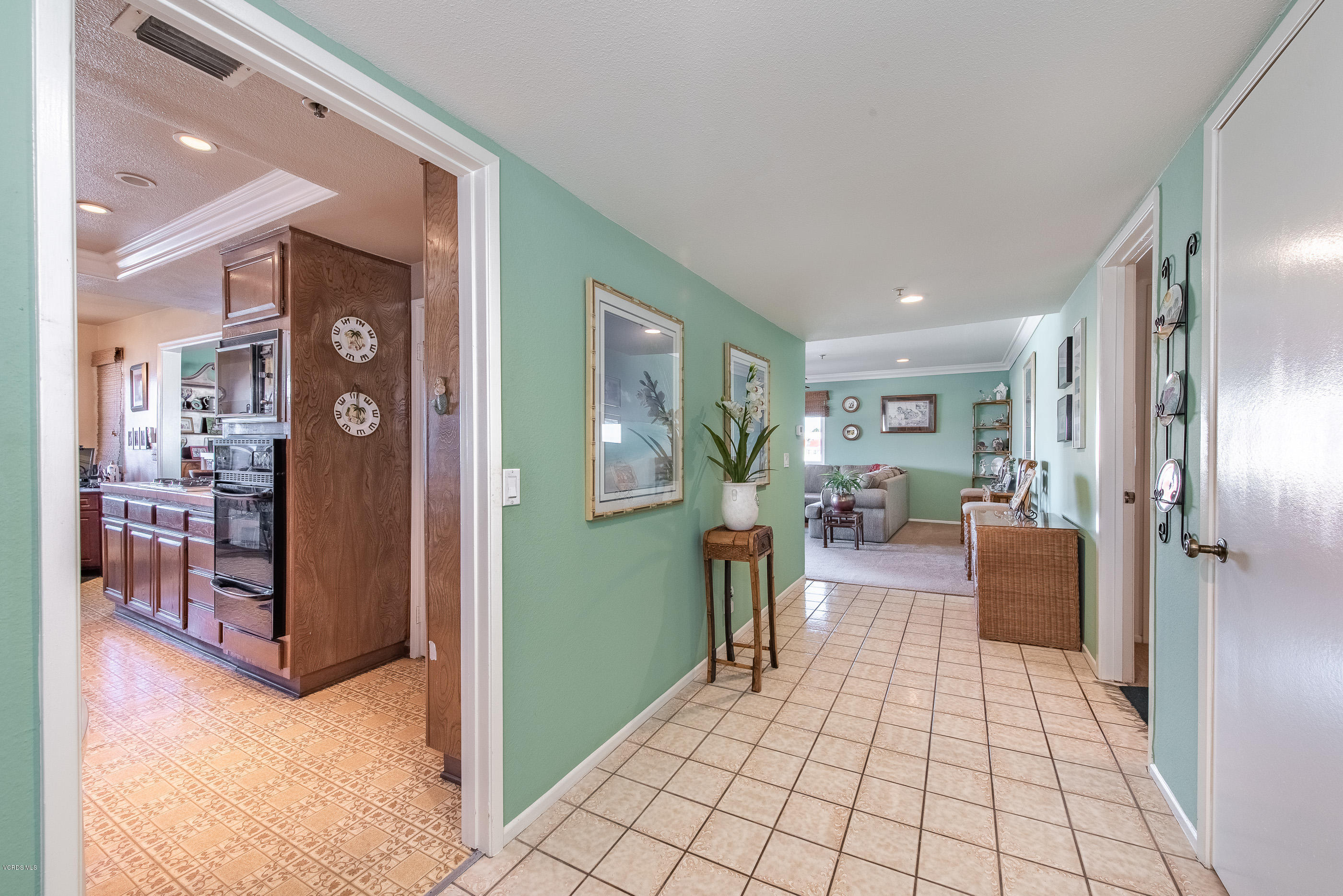 2872 Coast Circle, Unit 203 Huntington Beach, CA 92649 - Photo 9 of 42 a living room with furniture and a table