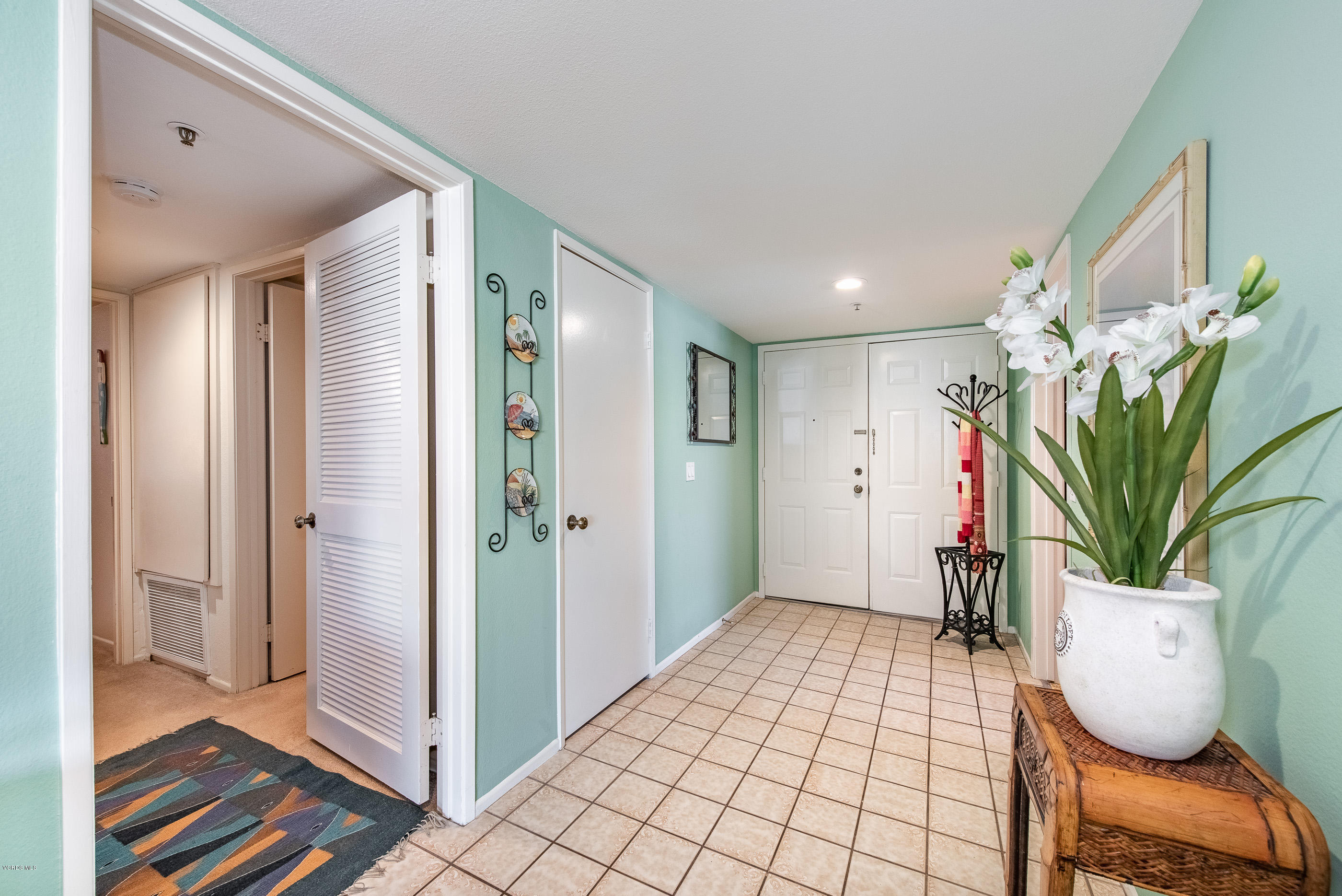 2872 Coast Circle, Unit 203 Huntington Beach, CA 92649 - Photo 10 of 42 a view of entryway with wooden floor