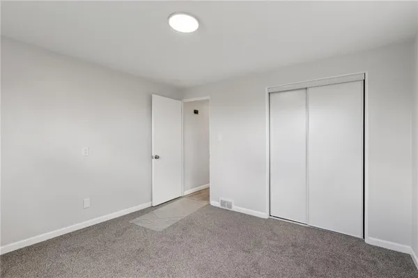 a bathroom with a sink mirror vanity and toilet