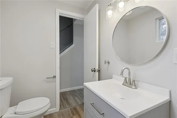 a view of a room with wooden floor