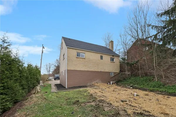 a picture of a bench in front of a wall