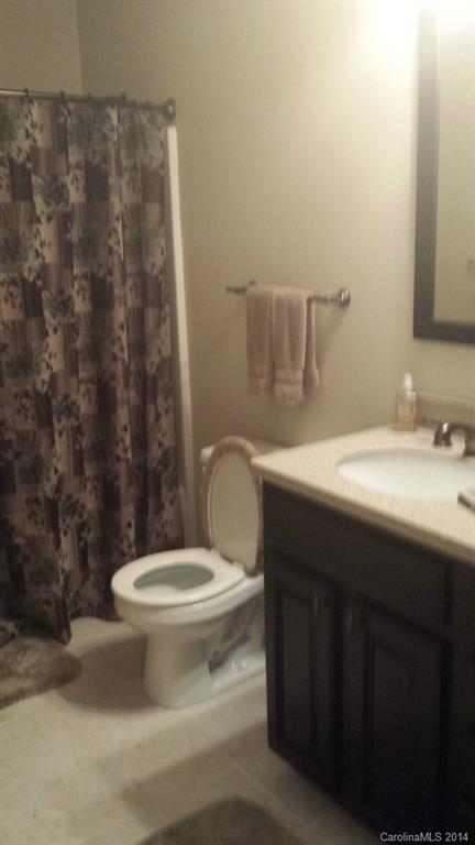 5465 Deer Run Court Davidson, NC 28036 - Photo 12 of 15 a bathroom with a sink and a toilet