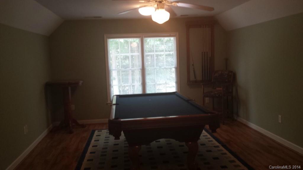 5465 Deer Run Court Davidson, NC 28036 - Photo 14 of 15 a room with wooden floor and a window