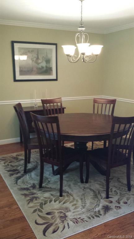 5465 Deer Run Court Davidson, NC 28036 - Photo 4 of 15 a view of a dining room with furniture