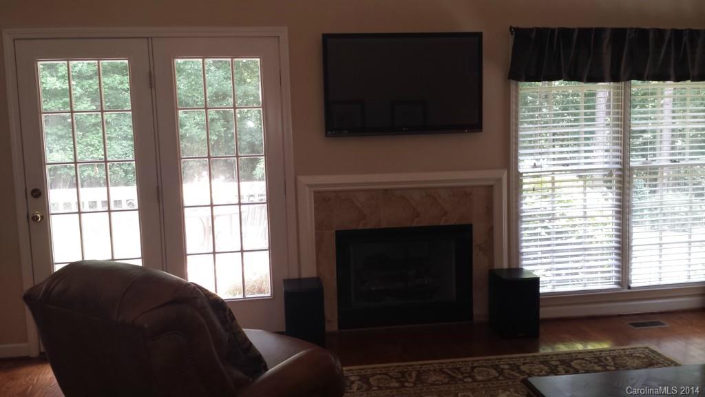 5465 Deer Run Court Davidson, NC 28036 - Photo 6 of 15 a living room with furniture and a fireplace