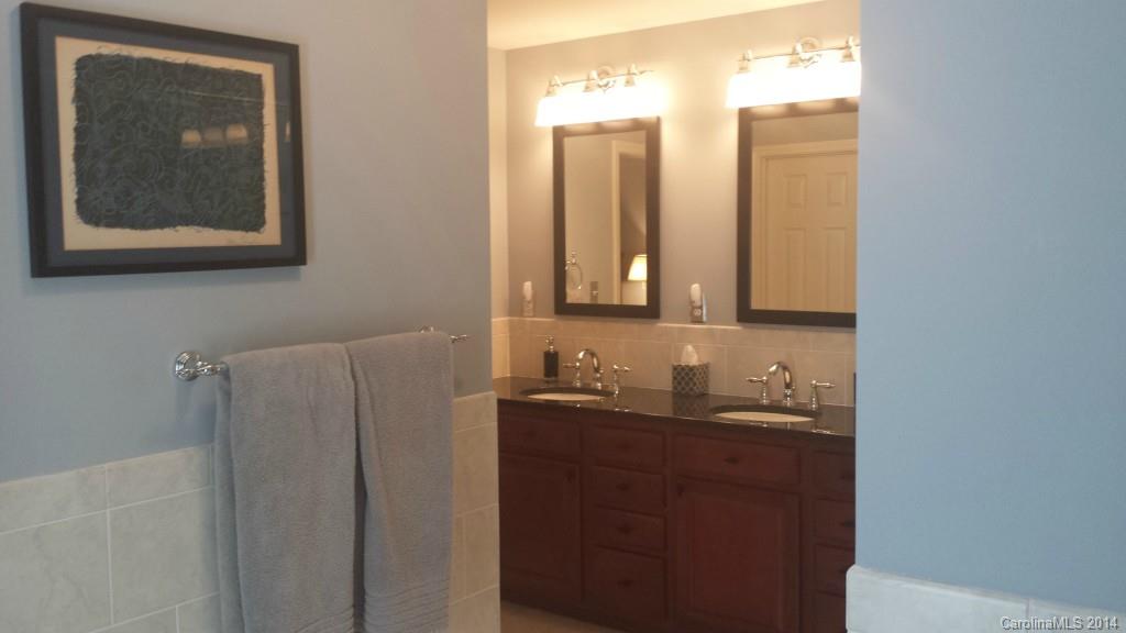 5465 Deer Run Court Davidson, NC 28036 - Photo 10 of 15 a bathroom with a double vanity sink and mirror