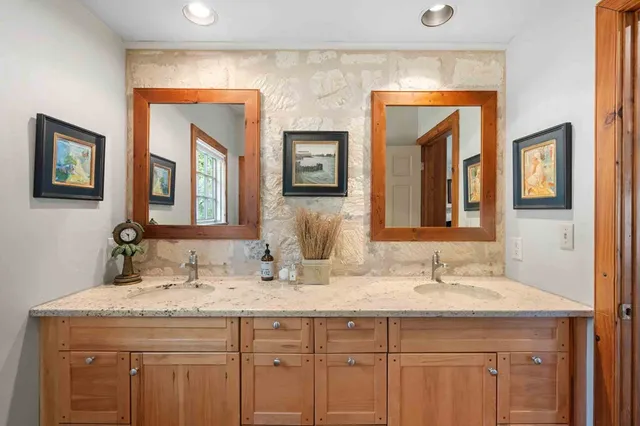 a view of a bathroom from a hallway