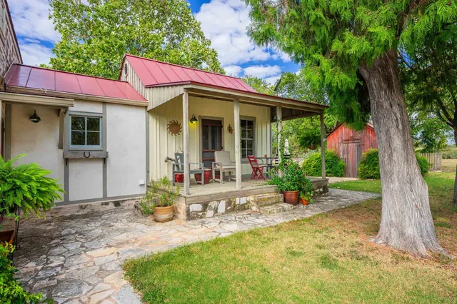 a view of swimming pool with seating area and furniture